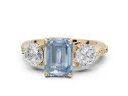 Emerald Cut Three Stone Engagement Ring Setting for a Fancy Blue Lab-Grown Diamond | Tapered Pave Band | Yellow Gold
