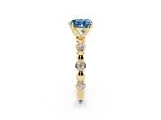 Fancy Blue Heart Cut Diamond Solitaire Ring Set in Yellow gold with Bezel-Set Accents on Beaded Band and Prong Setting