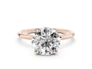 Round Cut Diamond Solitaire Engagement Ring Set in Rose gold with Thin Band and Prong Setting