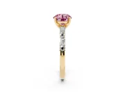 Fancy Pink Round Cut Diamond Solitaire Set in Yellow gold with Side Baguettes and Channel Set Band
