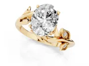 Oval Cut Diamond Solitaire Twist Engagement Ring Set in Yellow gold with Pavé Leaf Accents