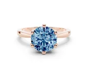 Fancy Blue Round Cut Diamond Solitaire Engagement Ring Set in Rose gold with Slim Tapered Solitaire Band