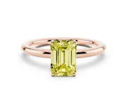 Fancy Yellow Emerald Cut Diamond Solitaire Ring Set in Rose gold with Prong Setting on a Polished Plain Band