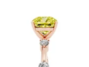 Fancy Yellow Cushion Cut Diamond Solitaire Ring Set in Rose gold with Bezel Set Side Stones and Prong Setting