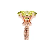 Fancy Yellow Oval Cut Diamond Solitaire Ring Set in Rose gold with Twisted Band and Bead Prong Setting