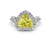Fancy Yellow Heart Cut Diamond Halo Engagement Ring Set in White gold with Filigree Band and Prong-Set Center