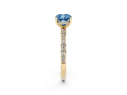 Fancy Blue Cushion Cut Diamond Pavé Band Ring Set in Yellow gold with Prong-Set Center Stone