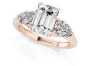 Three-Stone Emerald Cut Diamond Ring Set in Rose gold with Pear Side Stones and Prong Setting