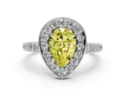 Fancy Yellow Pear Cut Diamond Halo Pavé Engagement Ring Set in White gold with Bezel Setting