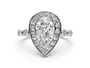 Pear Cut Diamond Halo Engagement Ring Set in Platinum with Twisted Band and Prong Setting
