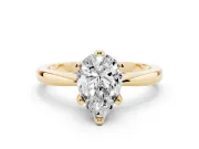 Pear Cut Diamond Solitaire Engagement Ring Set in Yellow gold with Slim Tapered Solitaire Band
