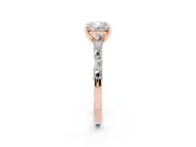 Cushion Cut Diamond Solitaire Set in Rose gold with Side Baguettes and Channel Set Band