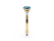 Round Three Stone Engagement Ring Setting for a Fancy Blue Lab-Grown Diamond | Tapered Baguettes | Yellow Gold