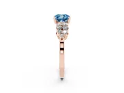 Fancy Blue Cushion Cut Diamond Cluster Engagement Ring Set in Rose gold with Pavé Band and Prong Setting