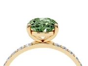 Fancy Green Oval Cut Diamond Solitaire Ring Set in Yellow gold with Round Pavé Band and Prong Setting