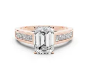 Emerald Cut Diamond Solitaire Ring Set in Rose gold with Channel-Set Band and Prong Setting