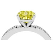 Fancy Yellow Cushion Cut Diamond Solitaire Ring Set in White gold with Slim Pavé Band and Prong Setting