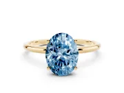 Fancy Blue Oval Cut Diamond Solitaire Engagement Ring Set in Yellow gold with Thin Band and Prong Setting