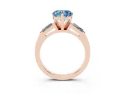 Fancy Blue Heart Cut Diamond Solitaire Ring Set in Rose gold with Tapered Baguette Side Stones and Prong Setting