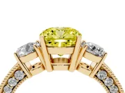 Fancy Yellow Cushion Cut Diamond Three-Stone Ring Set in Yellow gold with Round Side Stones and Pavé Band