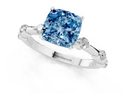 Fancy Blue Cushion Cut Diamond Solitaire Ring Set in White gold with Bezel Set Side Stones and Prong Setting