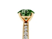 Fancy Green Round Cut Diamond Solitaire Ring Set in Yellow gold with Slim Pavé Band and Prong Setting