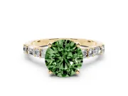 Fancy Green Round Cut Diamond Solitaire Set in Yellow gold with Side Baguettes and Channel Set Band