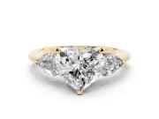 Three-Stone Heart Cut Diamond Ring Set in Yellow gold with Pear Side Stones and Prong Setting