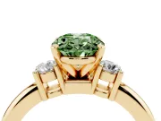 Fancy Green Three-Stone Oval Cut Diamond Ring Set in Yellow gold with Prong Setting and Plain Band
