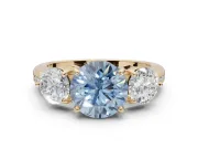Round Three Stone Engagement Ring Setting for a Fancy Blue Lab-Grown Diamond | Tapered Pave Band | Yellow Gold