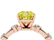 Fancy Yellow Cushion Cut Diamond Solitaire Ring Set in Rose gold with Bezel Set Side Stones and Prong Setting
