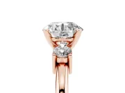 Three-Stone Round Cut Diamond Ring Set in Rose gold with Prong Setting and Plain Band