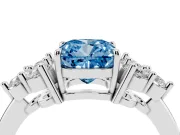 Fancy Blue Cushion Cut Diamond Solitaire Ring Set in White gold with Cluster Accents on Each Side