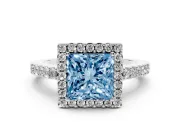Fancy Blue Princess Cut Diamond Halo Pavé Solitaire Ring Set in White gold with Prong-Set Center Stone