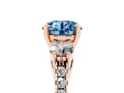 Fancy Blue Three-Stone Round Cut Diamond Pavé Band Ring Set in Rose gold with Prong-Set Trio