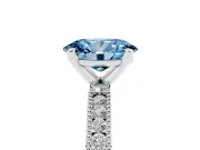 Fancy Blue Oval Cut Diamond Solitaire Ring Set in White gold with Slim Pavé Band and Prong Setting