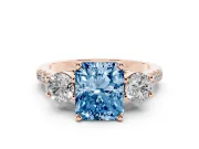 Fancy Blue Three-Stone Radiant Cut Diamond Pavé Band Ring Set in Rose gold with Prong-Set Trio