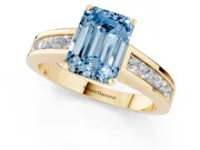Fancy Blue Emerald Cut Diamond Solitaire Ring Set in Yellow gold with Channel-Set Band and Prong Setting