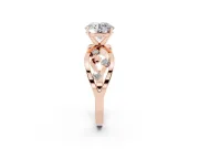 Round Cut Diamond Solitaire Ring Set in Rose gold with Side Stones on Criss-Cross Band and Prong Setting