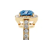 Fancy Blue Cushion Cut Diamond Halo Pavé Engagement Ring Set in Yellow gold with Bezel Setting