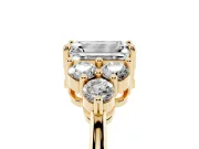 Emerald Cut Diamond Solitaire Ring Set in Yellow gold with Cluster Accents on Each Side