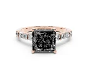 Fancy Black Princess Cut Diamond Solitaire Set in Rose gold with Side Baguettes and Channel Set Band