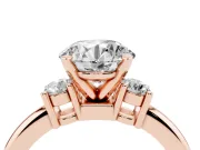 Three-Stone Round Cut Diamond Ring Set in Rose gold with Prong Setting and Plain Band