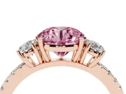 Fancy Pink Round Cut Diamond Three-Stone Ring Set in Rose gold with Pavé Band and Graduated Sides