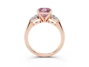 Fancy Pink Three-Stone Princess Cut Diamond Ring Set in Rose gold with Pear Side Stones and Prong Setting