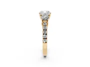 Cushion Cut Diamond Three-Stone Ring Set in Yellow gold with Round Side Stones and Delicate Pavé Band