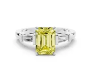 Fancy Yellow Emerald Cut Diamond Solitaire Ring Set in Silver with Tapered Baguette Accents and Prong Setting