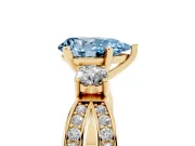 Fancy Blue Three-Stone Pear Cut Diamond Twist Band Ring Set in Yellow gold with Pavé Accents and Prong Setting