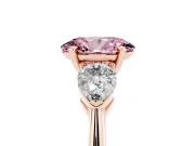 Fancy Pink Three-Stone Oval Cut Diamond Ring Set in Rose gold with Pear Side Stones and Prong Setting