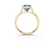 Fancy Blue Bezel Set Princess Cut Diamond Solitaire Ring Set in Yellow gold with Tapered Band